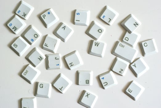 Scattered keyboard buttons on white background, illustration of keyboard typing photo