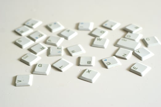 Scattered keyboard buttons on white background, illustration of keyboard typing photo