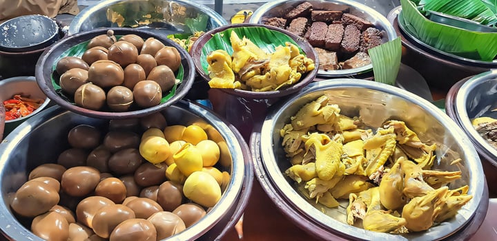 dishes served in Indonesian food Liwet Rice. Traditional javanese Rice Served with Chicken, Tofu, Tempeh, vegetable, Chili, egg photo