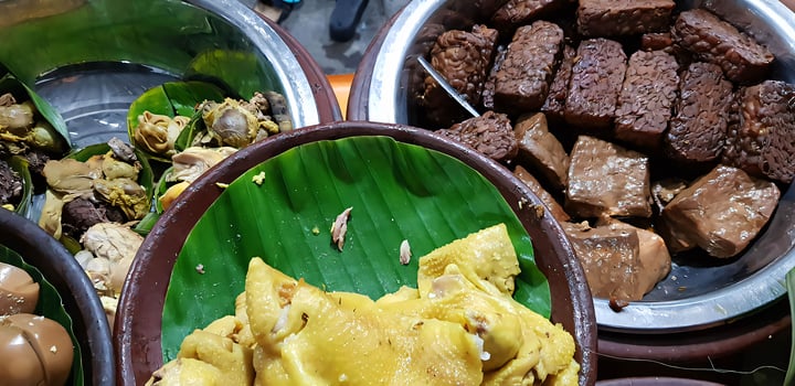 dishes served in Indonesian food Liwet Rice. Traditional javanese Rice Served with Chicken, Tofu, Tempeh, vegetable, Chili, egg photo