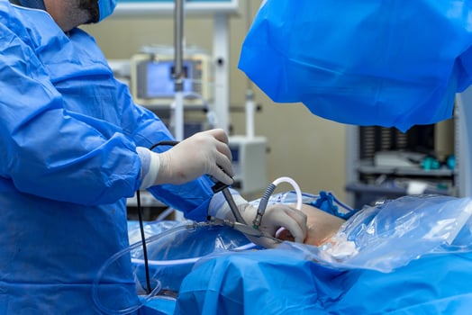 Surgery modern operating equipment. Group of specialists performing operation. photo