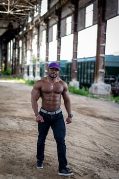 Shirtless muscular man outdoor walking. Sexy body person. photo
