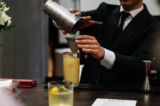 Preparation of a delicious cocktail based on juice and fruit. photo