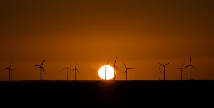 Windmills at sunset photo