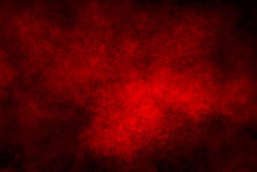 Vibrant Red Powder Explosion on Dark Background. photo