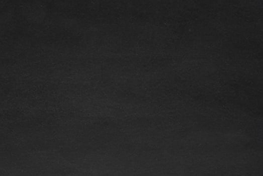 Dark Paper Texture with Spotlight on Dark Wall Background photo
