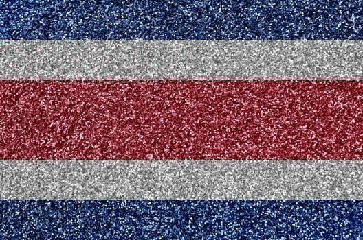 Costa Rica flag depicted on many small shiny sequins. Colorful festival background for party photo
