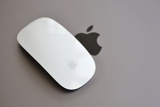 KYIV, UKRAINE - NOVEMBER 27, 2023 Apple Magic Mouse 3rd generation lies with grey MacBook 2021 photo