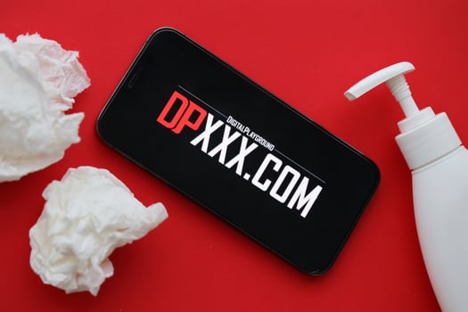 KYIV, UKRAINE - JANUARY 23, 2024 DigitalPlayground adult content website logo on display of iPhone 12 Pro photo