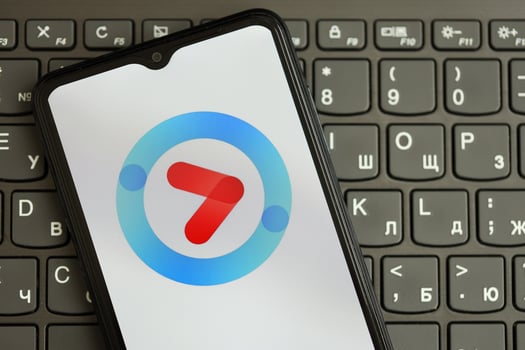 KYIV, UKRAINE - APRIL 1, 2024 Youku icon on smartphone screen on black keyboard photo