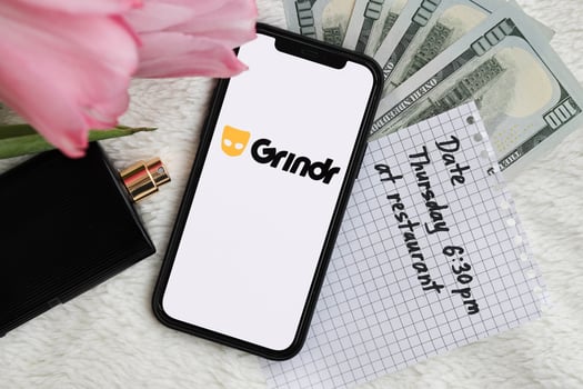 KYIV, UKRAINE - FEBRUARY 23, 2024 Grindr logo of famous dating website or app on iPhone display photo