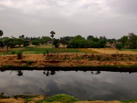 Water cannel built adjacent to a village road in a village in Bihar India photo