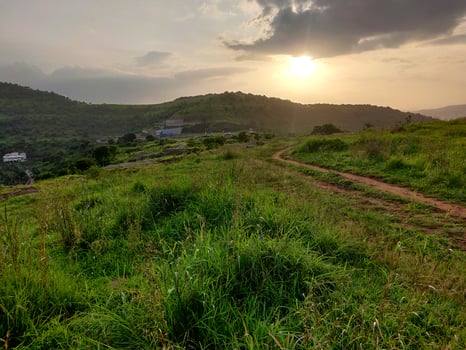 An old earthen road path running beyond the hills photo