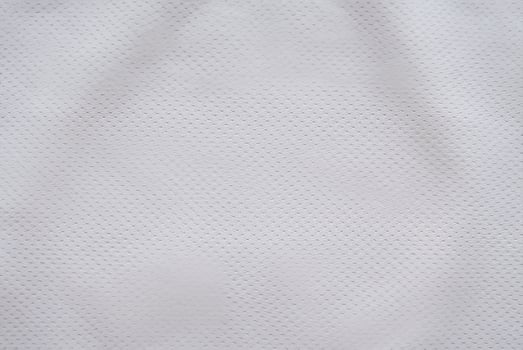 White Air Mesh Football Jersey on Fabric Background photo