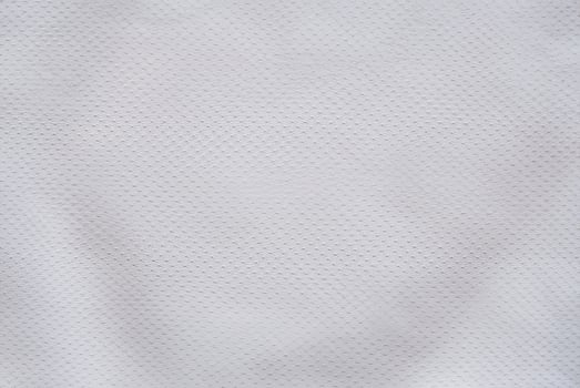 White Air Mesh Football Jersey on Fabric Background photo