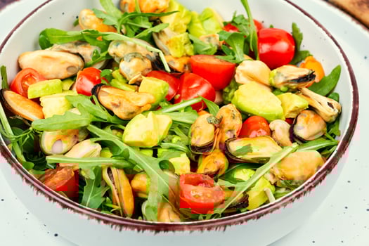 Salad with mussels, herbs and vegetables. photo
