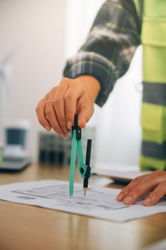 Wind energy engineer designing and developing project for residential district photo