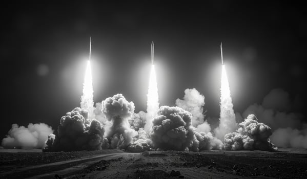 Three rockets launching into the night sky. Missile salvo fire lights up the night photo