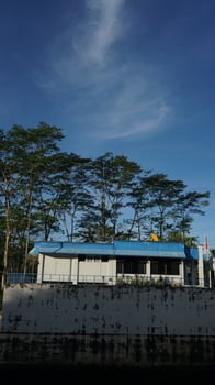Mini office beside a water storage dam photo