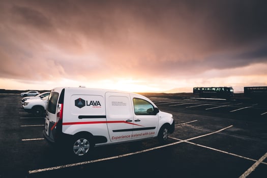 Reykjavik, Iceland, 2023 - famous budget Lava company rented white camper van stand in parking lot in Iceland with sunset background photo