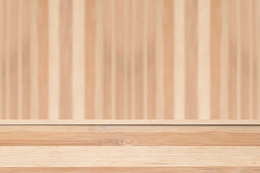 Empty wooden table over blurred wooden wall background. For product display photo