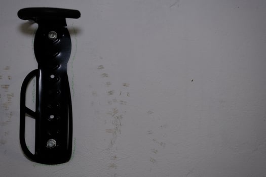 Bicycle tire hook clamp on the wall photo