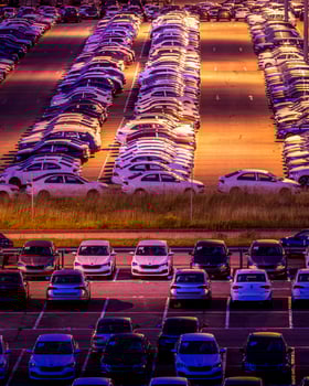Volkswagen, Russia, Kaluga - AUGUST 26, 2020 New cars parked at distribution center automobile factory at night with lights. Parking on the open air. photo