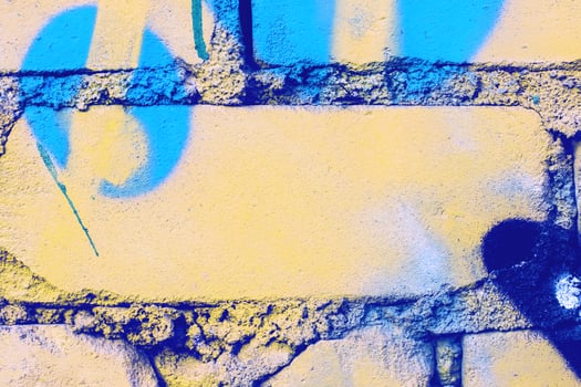 Fragment of colored graffiti painted on a wall. photo