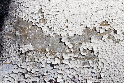 Texture of old white peeling paint on a concrete surface. Abstract backdrop for design. photo