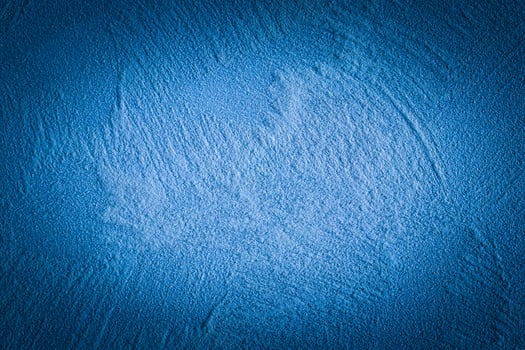 Blue decorative plaster texture with vignette. Abstract grunge background with copy space. photo