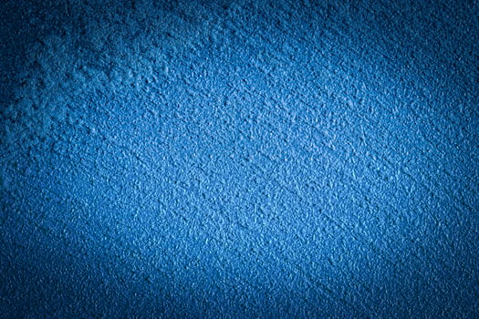 Blue decorative plaster texture with vignette. Abstract grunge background with copy space. photo