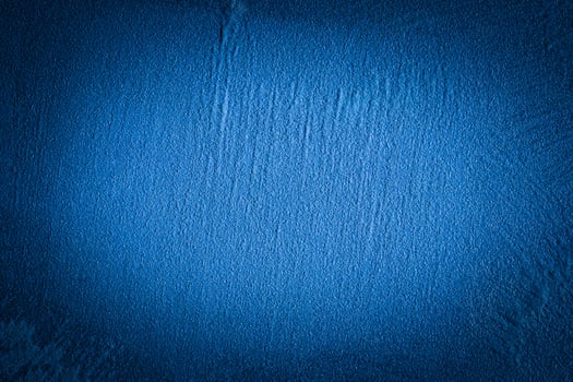 Blue decorative plaster texture with vignette. Abstract grunge background with copy space. photo