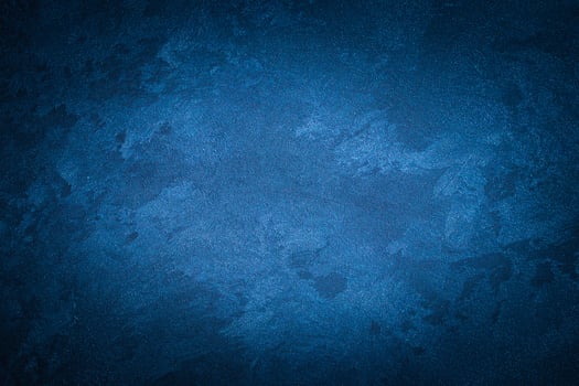 Blue decorative plaster texture with vignette. Abstract grunge background with copy space. photo