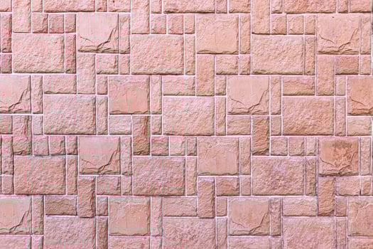 Texture of a wall covered with decorative brick-like tiles. Abstract background for design. photo