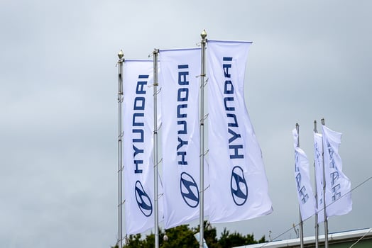 Russia, Kaluga - SEPTEMBER 29, 2020 White flags with Hyundai logos waving in the wind near a dealership. photo