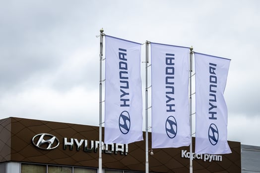Russia, Kaluga - SEPTEMBER 29, 2020 White flags with Hyundai logos waving in the wind near a dealership. photo