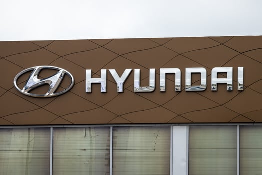 Russia, Kaluga - SEPTEMBER 29, 2020 Metallic Hyundai logo on a roof of a dealership. photo