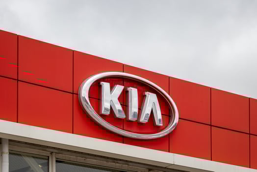 Russia, Kaluga - SEPTEMBER 29, 2020 Metallic Kia Motors logo on a roof of a dealership. photo
