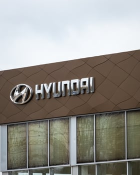 Russia, Kaluga - SEPTEMBER 29, 2020 Metallic Hyundai logo on a roof of a dealership. photo