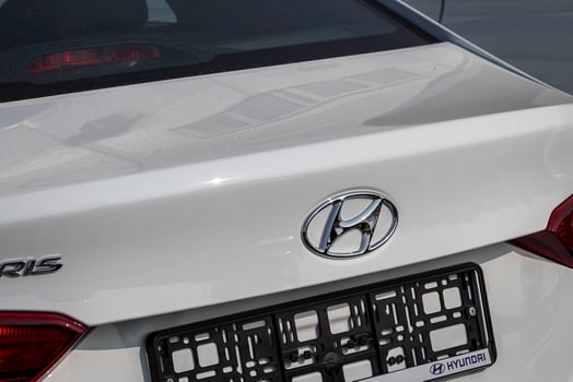 Russia, Kaluga - SEPTEMBER 29, 2020 Chrome-plated Hyundai logo on the trunk of a new car. photo