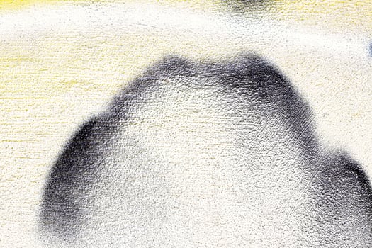 A fragment of colorful graffiti painted on a wall. Abstract urban background. photo