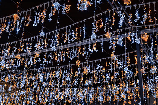 Christmas garlands with LED lamps against the black night sky. photo