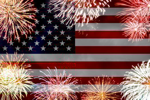 Concept of celebrating Independence Day in United States of America. USA national flag with fireworks backdrop for 4th of July. photo