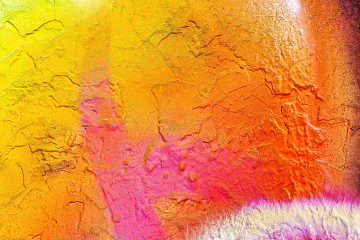 A fragment of colorful graffiti painted on a wall. Abstract urban background. photo