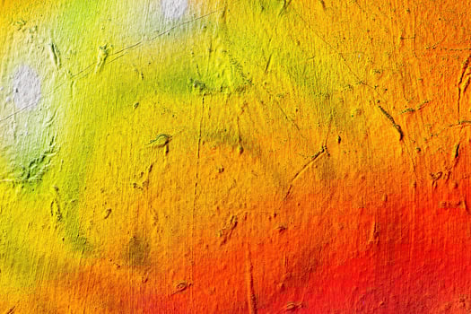 A fragment of colorful graffiti painted on a wall. Abstract urban background. photo