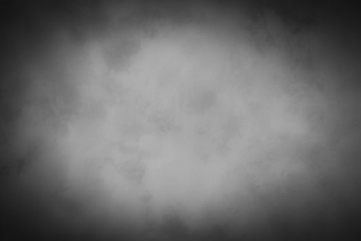 Blured gray decorative plaster or concrete background with vignette. photo