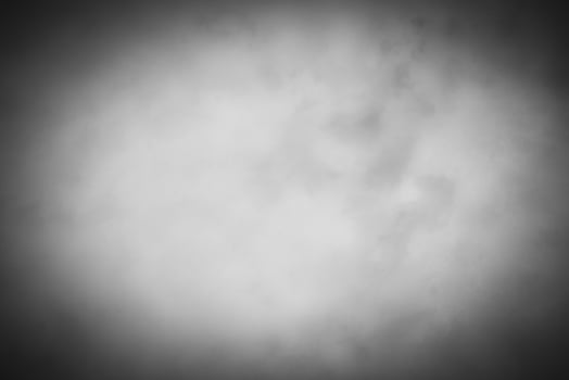 Blured gray decorative plaster or concrete background with vignette. photo