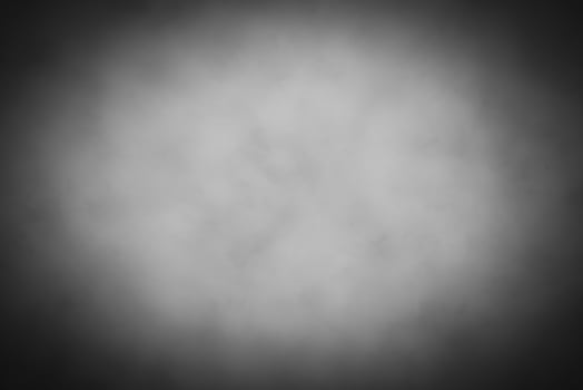 Blured gray decorative plaster or concrete background with vignette. photo