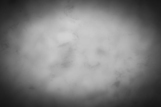 Blured gray decorative plaster or concrete background with vignette. photo
