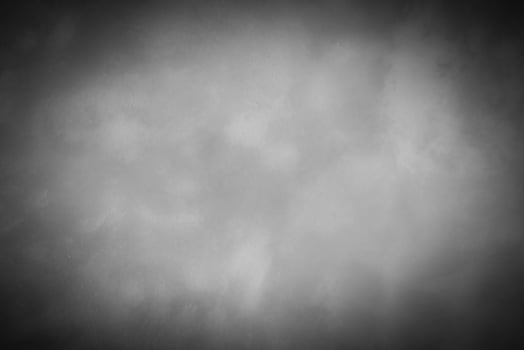 Gray decorative plaster or concrete background with vignette. photo